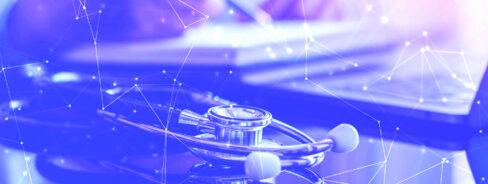 A stethoscope rests on a reflective surface with a person using a laptop in the background, overlaid with digital network lines and points.