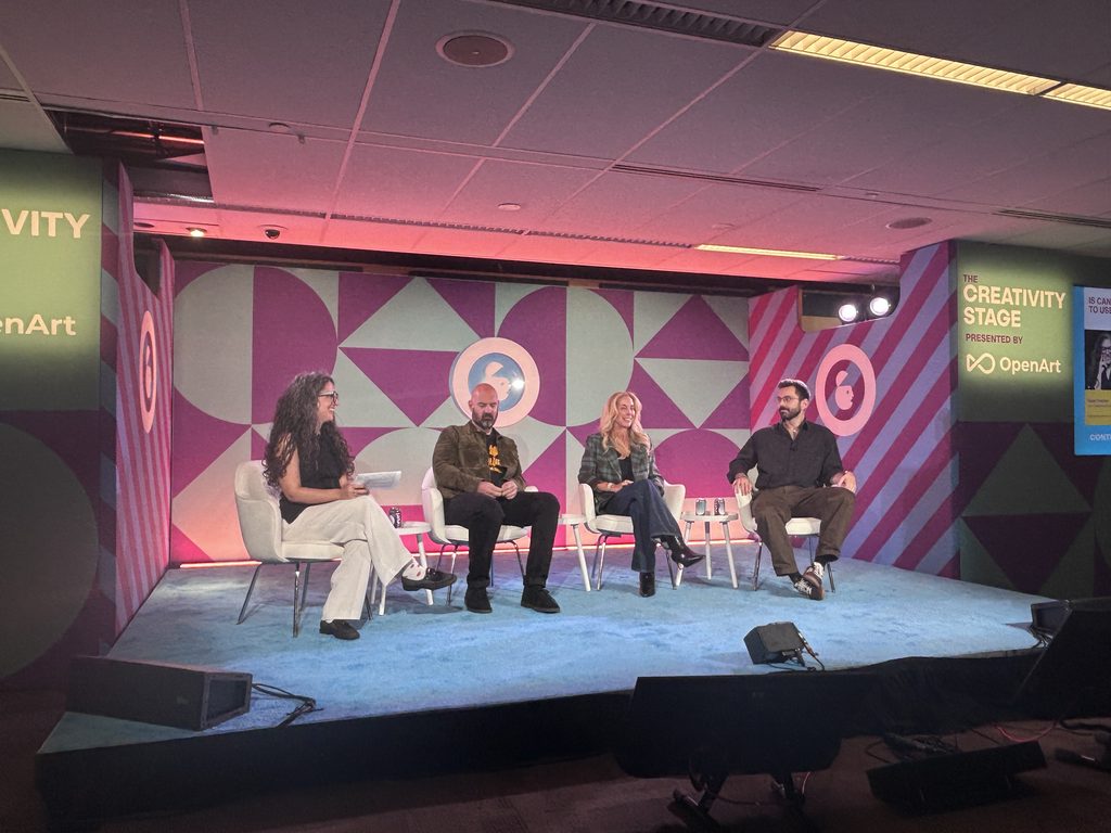 Four people sitting on a panel at Advertising Week New York